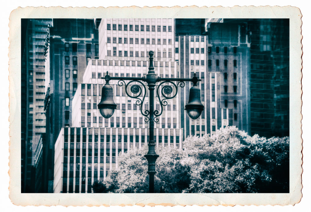 Postcard black and white photo of a wrought iron street lamp in New York City