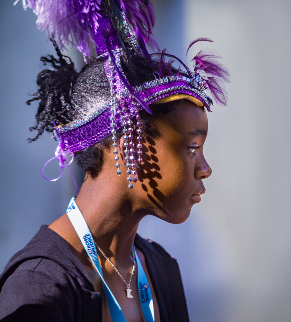 Photo of Girl in purple head dress at Notting Hill Carnival, London