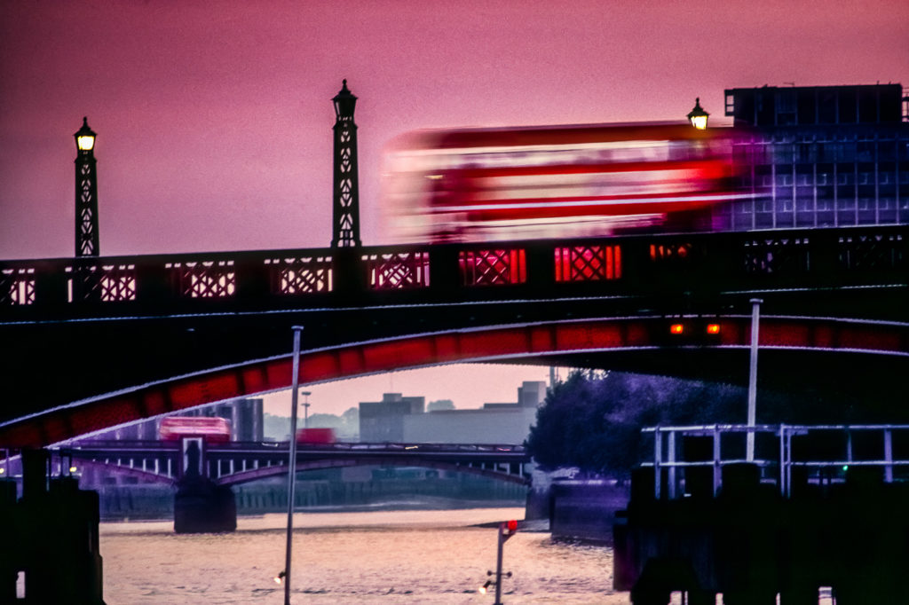 London Red Bus going over Lambeth Bridge, Central London, England